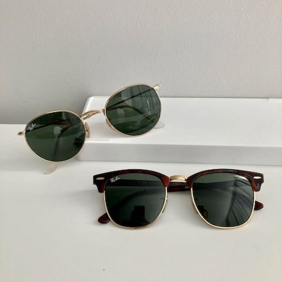 Two pairs of Ray-Ban sunglasses on a white background
