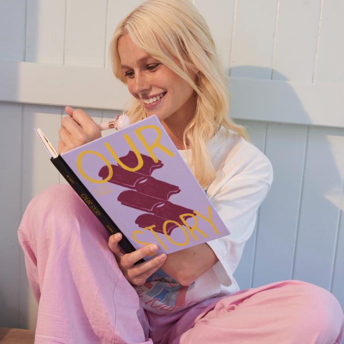 Girl reading and smiling