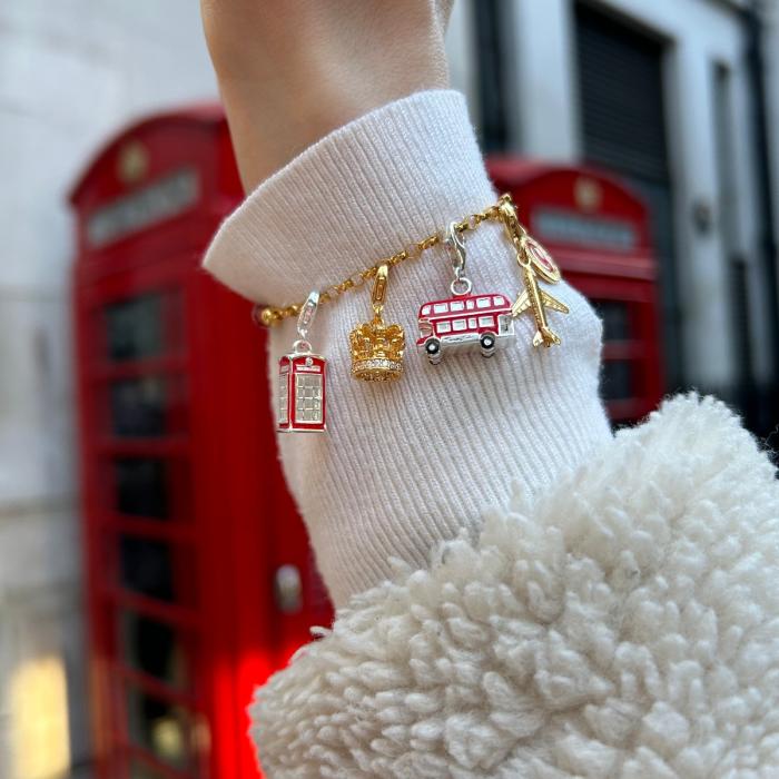 Model wearing charm bracelet with London charms